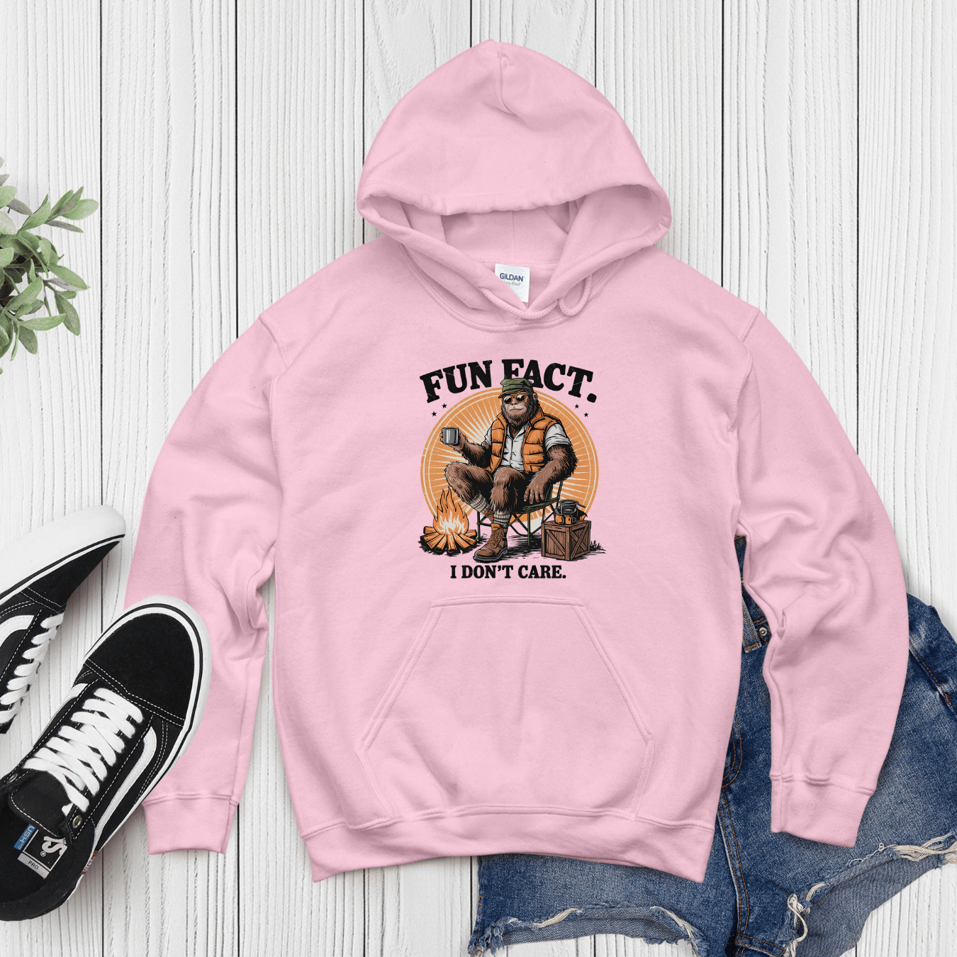Pink hoodie with humorous camping design and bold “Fun Fact I Don’t Care” text for casual streetwear style