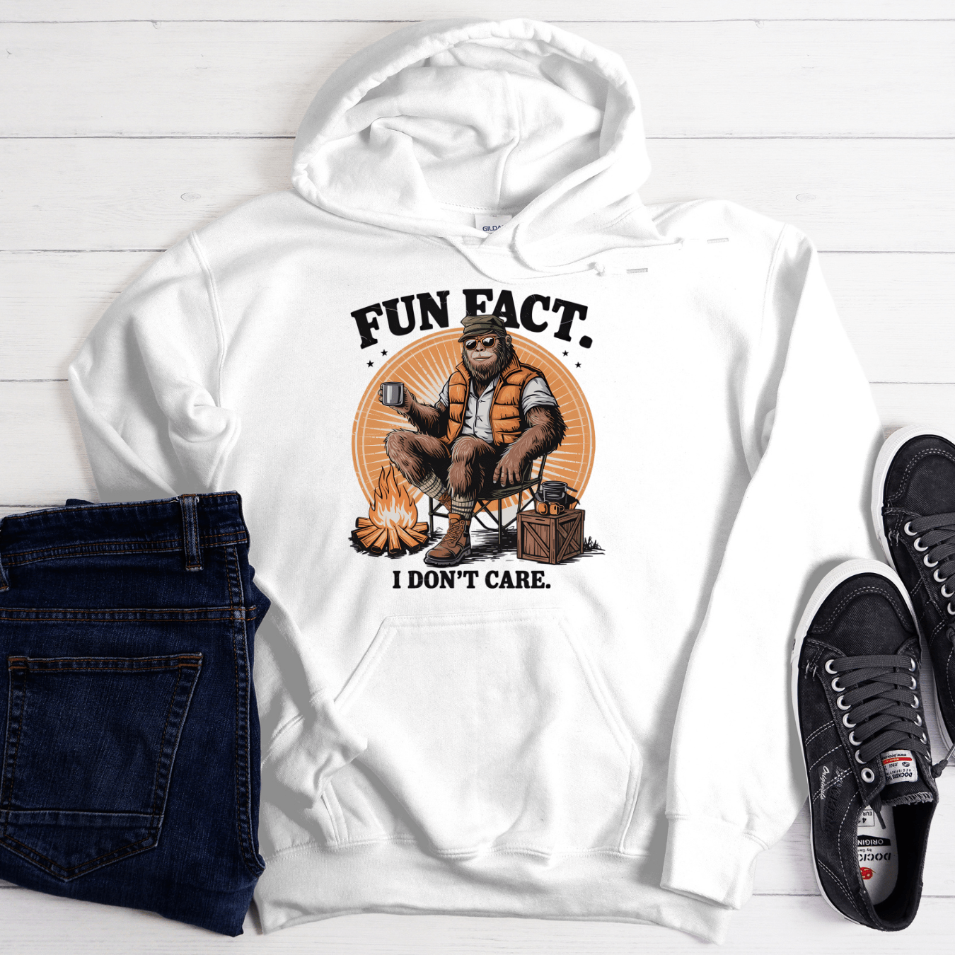 White hoodie with funny “Fun Fact I Don’t Care” camping graphic featuring relaxed outdoor character design