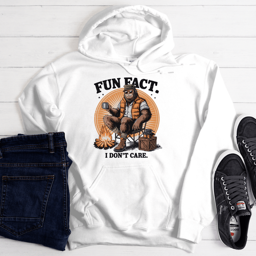 White hoodie with funny “Fun Fact I Don’t Care” camping graphic featuring relaxed outdoor character design