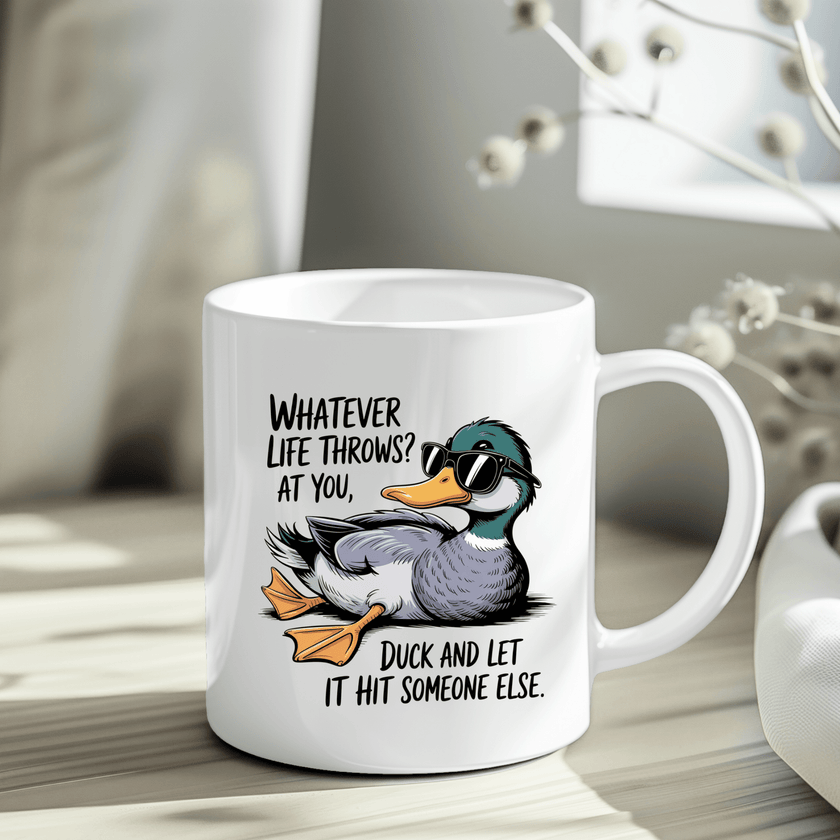 White ceramic mug with a cartoon duck wearing sunglasses and a funny quote