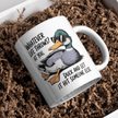 Funny novelty mug lying in packaging displaying humorous duck illustration and sarcastic quote.