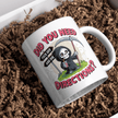 White ceramic coffee mug with an adorable cartoon Grim Reaper illustration and bold dark humor text, perfect gift.
