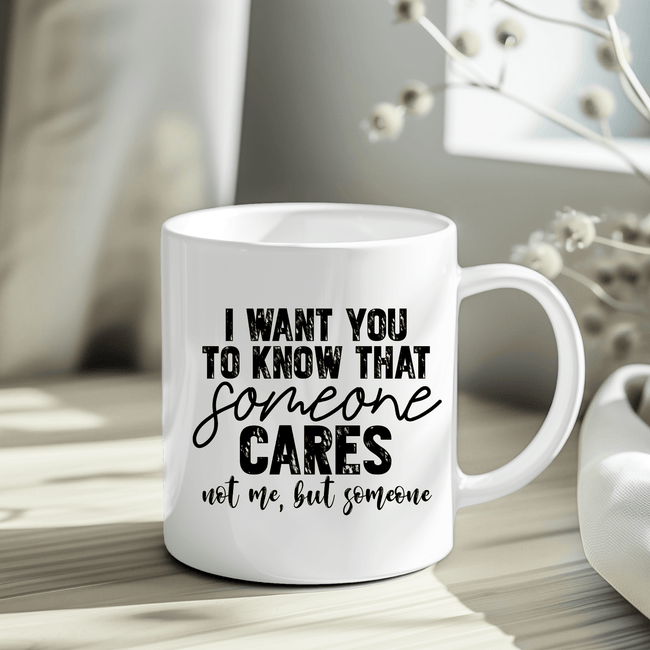 Close-up of a sarcastic humor mug with black typography, shown inside packaging with crinkle paper for gifting.