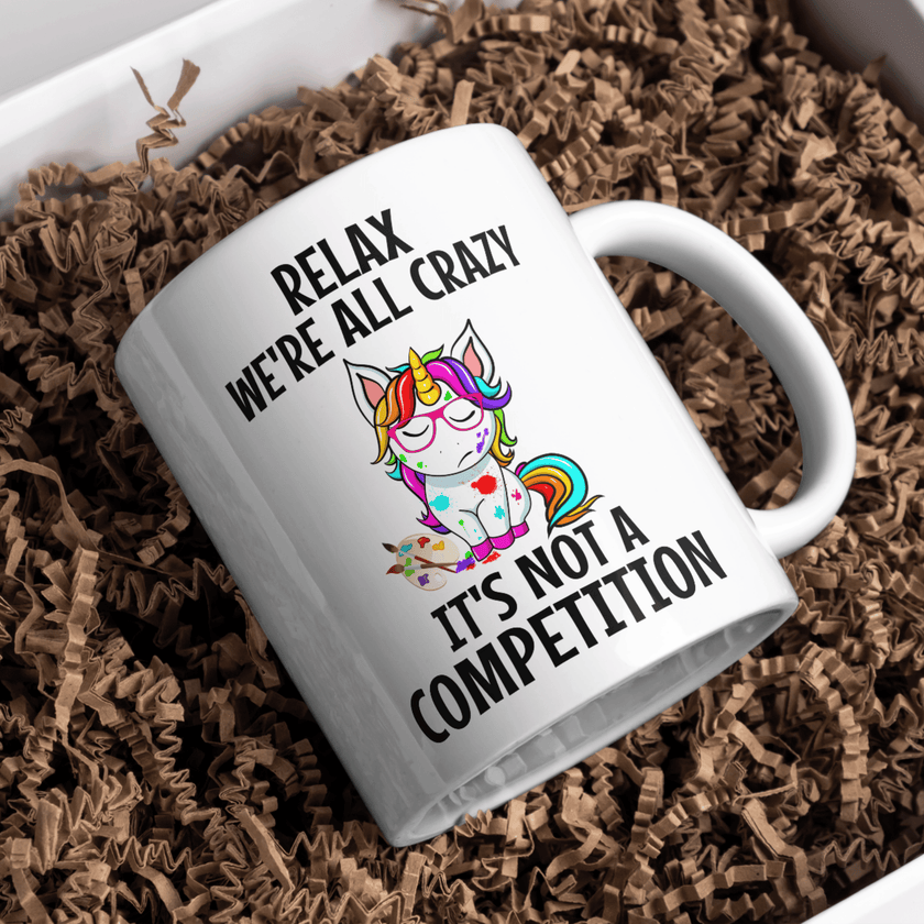 White ceramic mug with colorful unicorn design and funny saying, perfect gift for unicorn lovers.