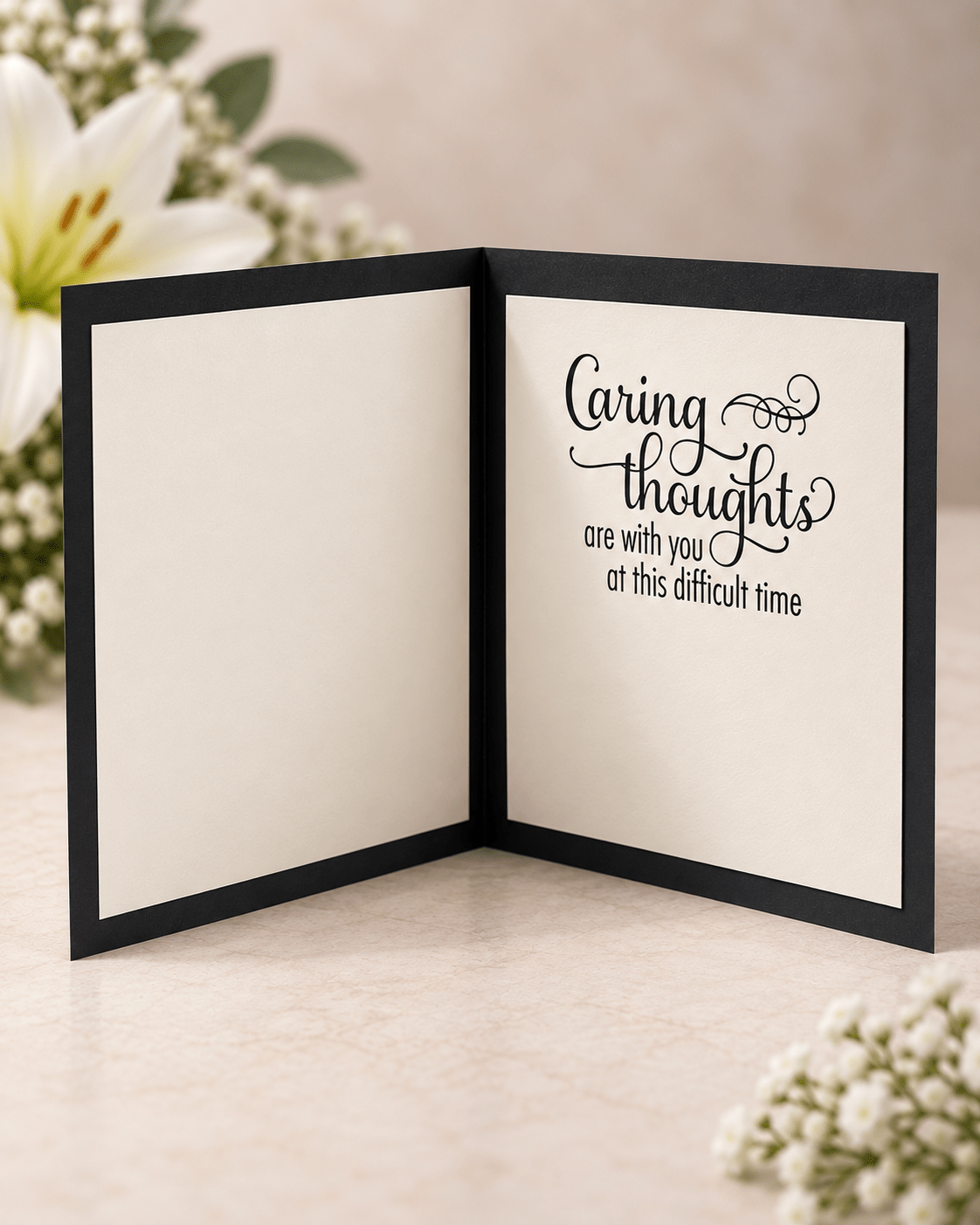 Open handmade bereavement card showing the message Caring thoughts are with you at this difficult time with space for a personal note.