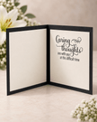 Open handmade bereavement card showing the message Caring thoughts are with you at this difficult time with space for a personal note.