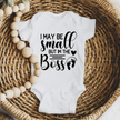 Soft white newborn onesie featuring humorous little boss design for baby gifts and everyday wear