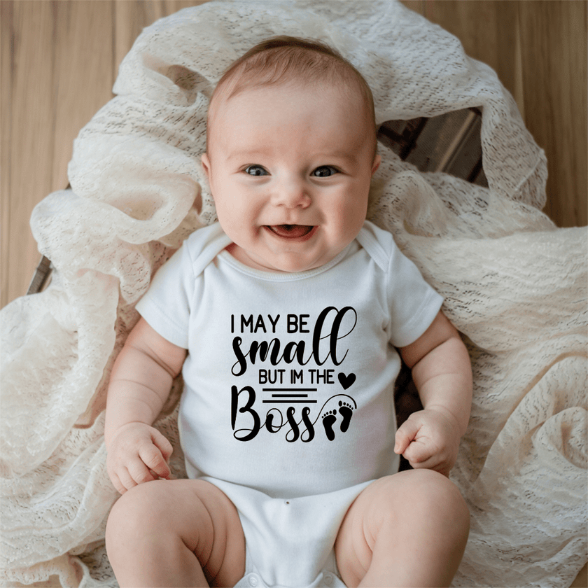 Funny baby boss bodysuit in white with playful typography design for baby shower gift ideas