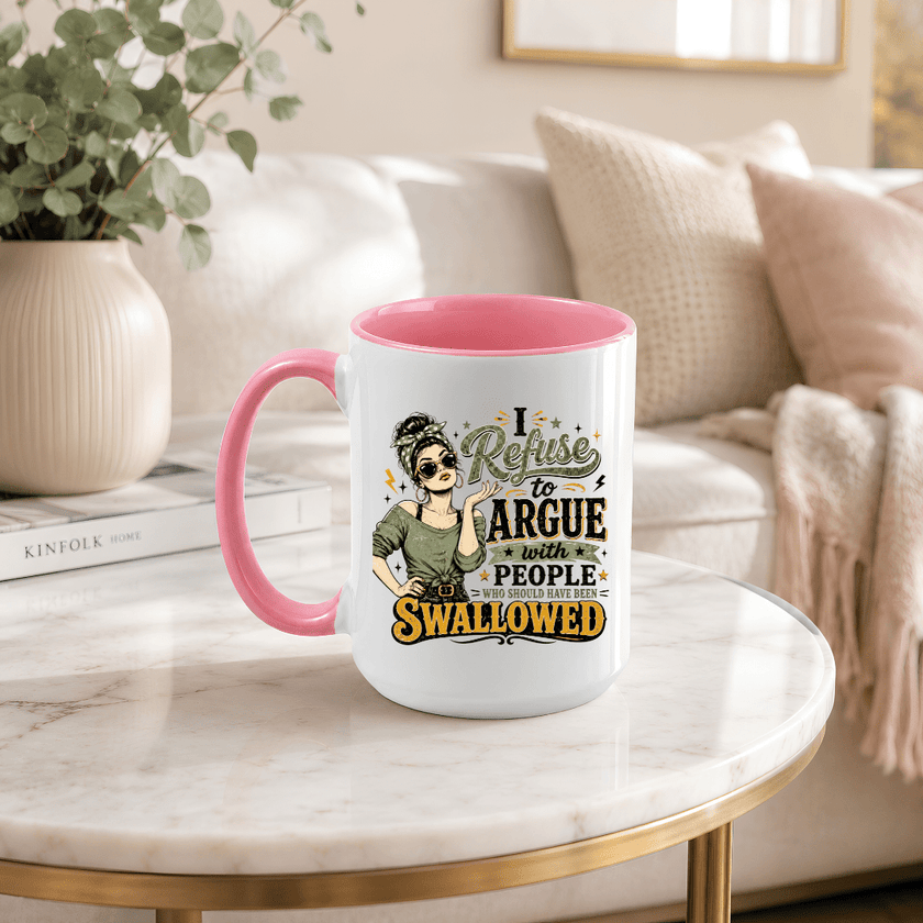 Pink handle and interior funny coffee mug with sarcastic I Refuse to Argue statement graphic on coffee table