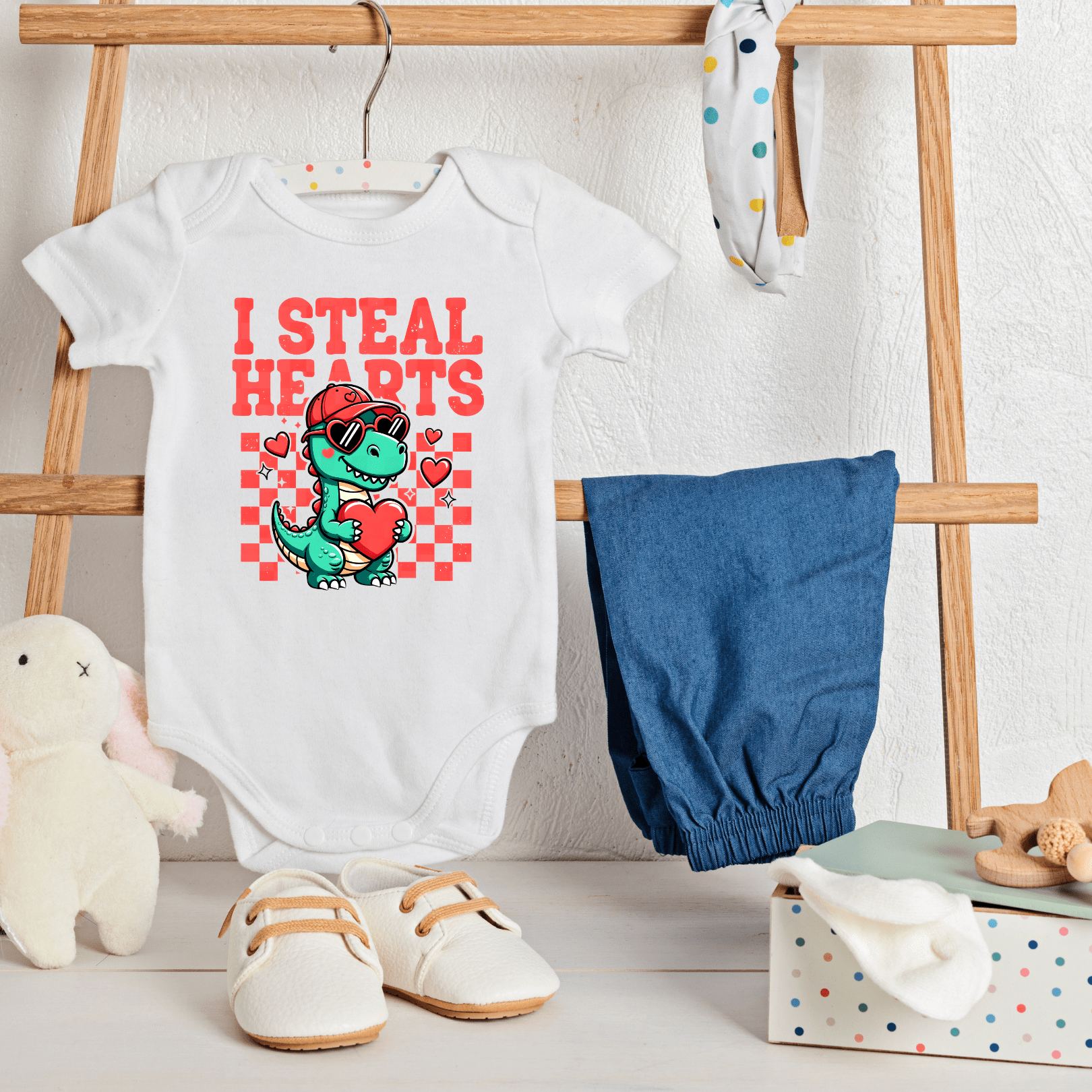 Valentine themed baby onesie with dinosaur holding heart