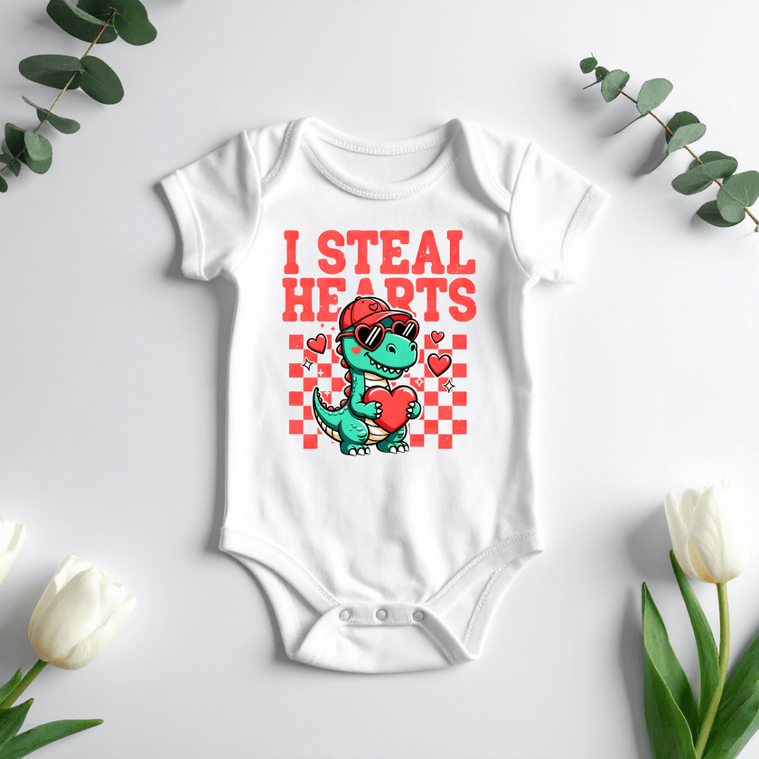 Cute dinosaur heart design printed on white baby bodysuit
