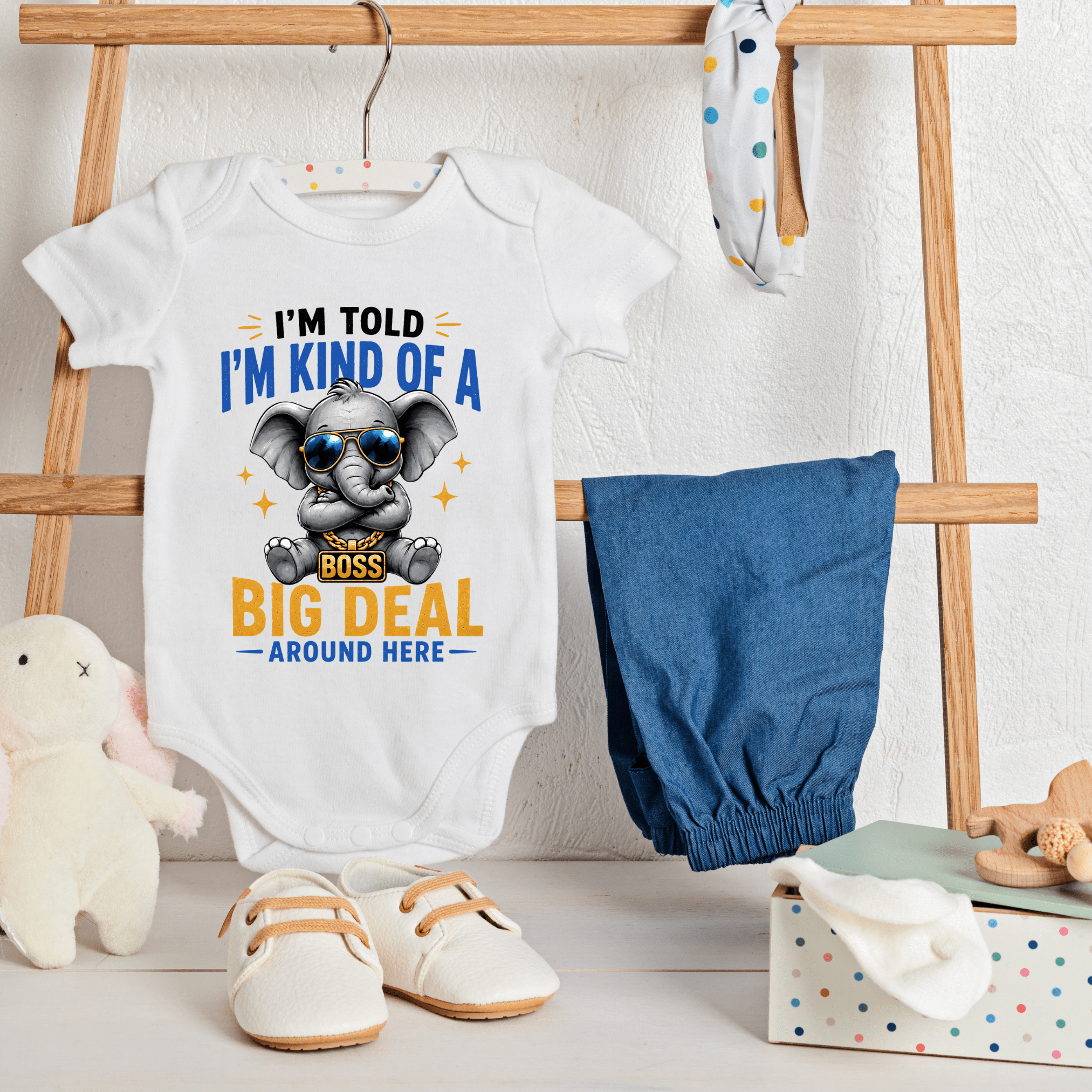 White baby onesie featuring funny elephant with sunglasses and I’m Kind Of A Big Deal Around Here quote