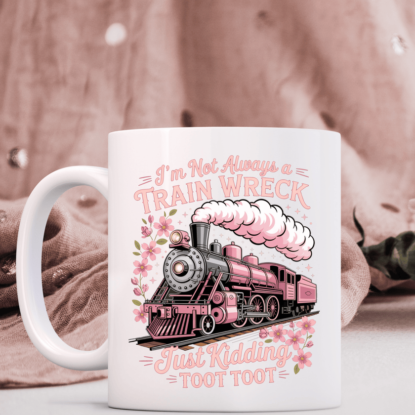 Funny pink train coffee mug featuring humorous text and floral accents on soft pink lifestyle background
