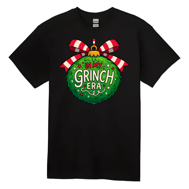 Black t-shirt with a festive design featuring a green ornament and red and white striped bow on a white background.