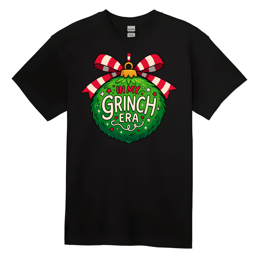 Black t-shirt with a festive design featuring a green ornament and red and white striped bow on a white background.