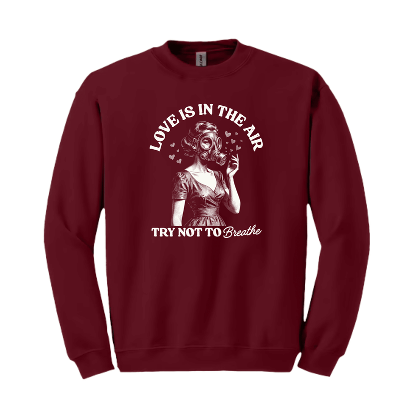 Maroon crewneck sweatshirt featuring “Love Is In The Air – Try Not to Breathe” vintage graphic illustration design