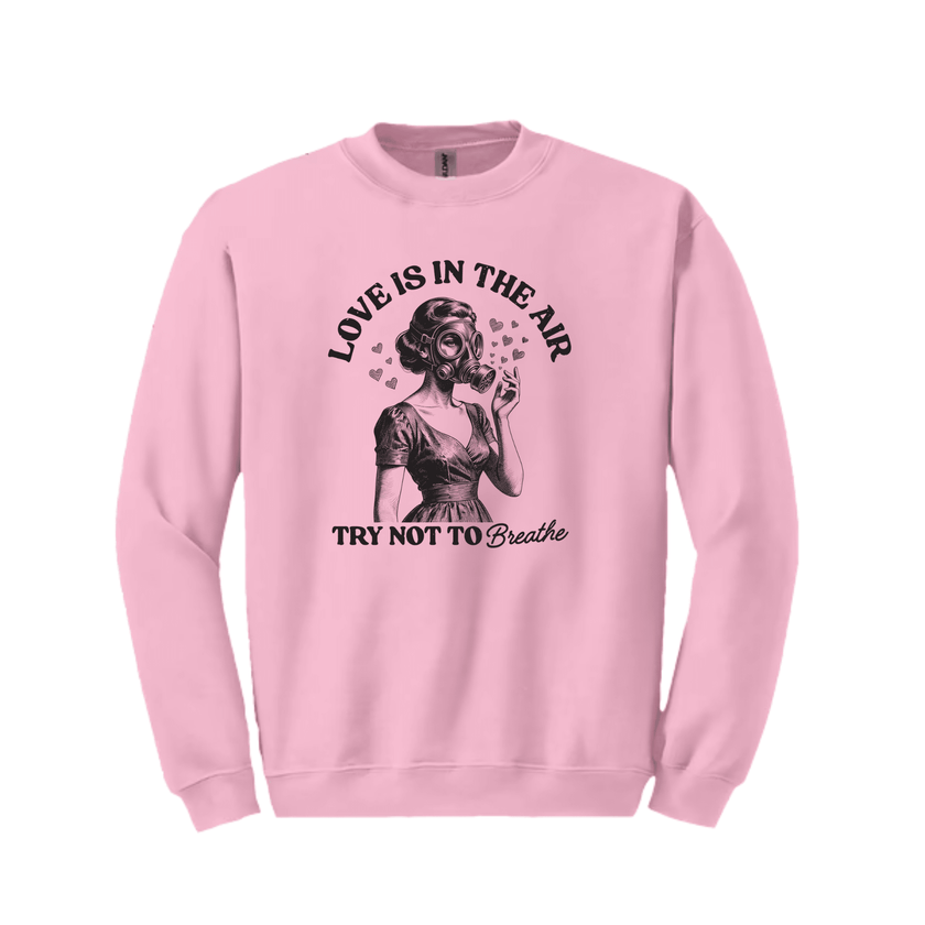 Trendy casual crewneck sweatshirt with humorous Love Is In The Air statement design