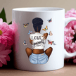 Self-love themed mug with empowering artwork of a woman and butterflies on a white ceramic cup.