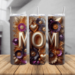 Floral MOM tumbler cup with gold letters, purple and gold flowers, insulated travel mug with lid and straw on wood surface