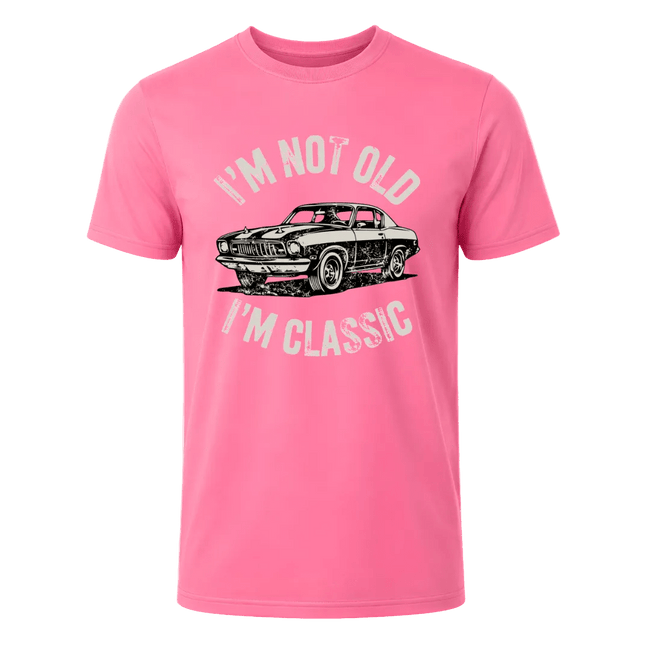 Light pink men’s vintage vehicle shirt with a bold front print and playful statement about being classic.