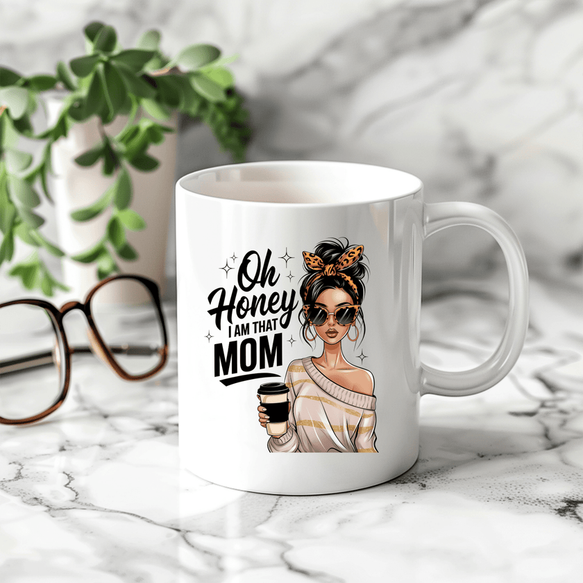 White coffee mug with “Oh Honey I Am That Mom” quote and stylish woman illustration holding coffee