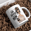 White mug displayed on table with flowers and stylish mom graphic design