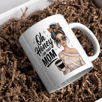 White mug displayed on table with flowers and stylish mom graphic design