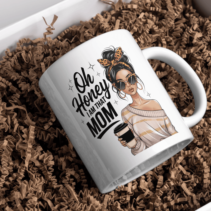 White mug displayed on table with flowers and stylish mom graphic design