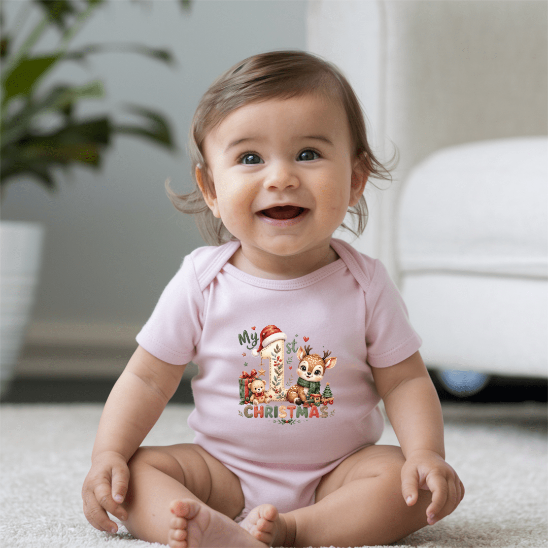Light pink My First Christmas baby onesie with sweet woodland reindeer and Christmas gift artwork.