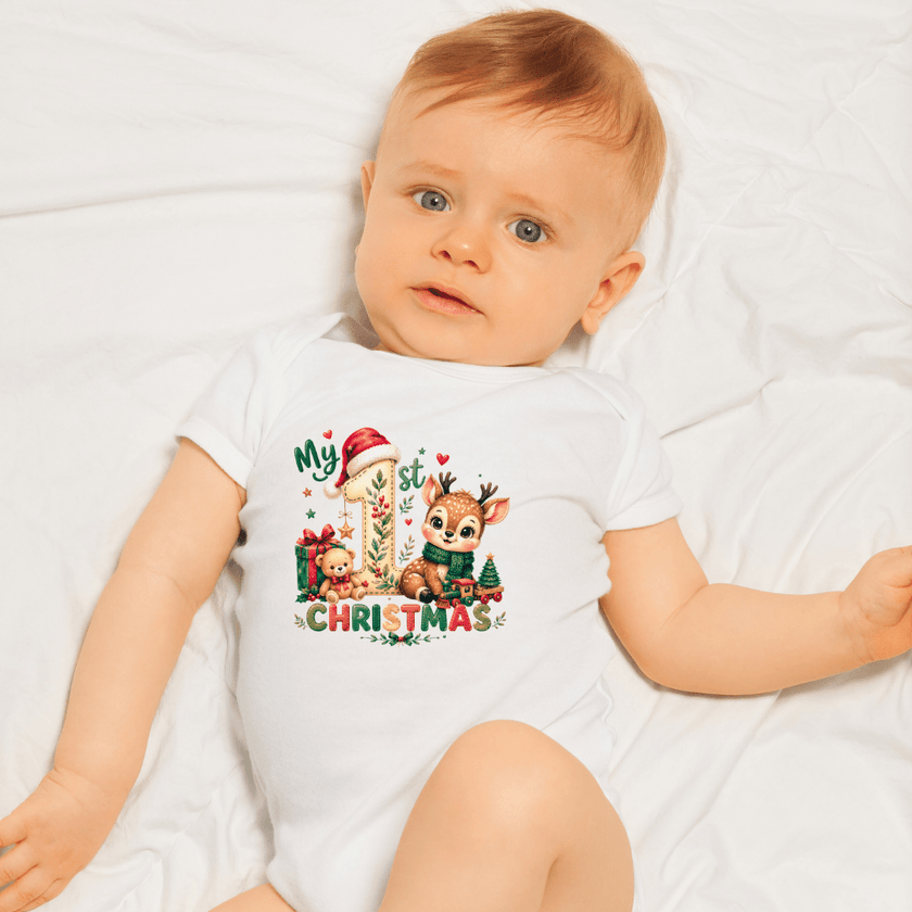 Christmas baby bodysuit with large number one, Santa hat, reindeer, presents and seasonal holiday accents.