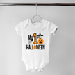 White My First Halloween baby bodysuit featuring a large orange number one, jack o lantern, bat and spiderweb.
