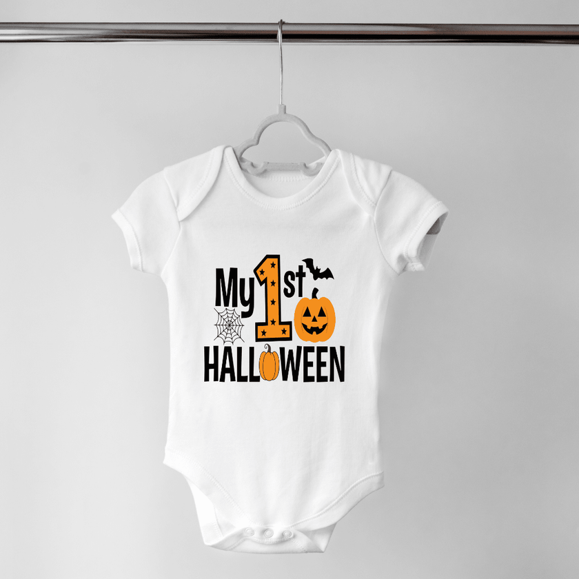 White My First Halloween baby bodysuit featuring a large orange number one, jack o lantern, bat and spiderweb.