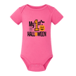 Hot pink baby Halloween bodysuit with My First Halloween graphic and orange jack o lantern.