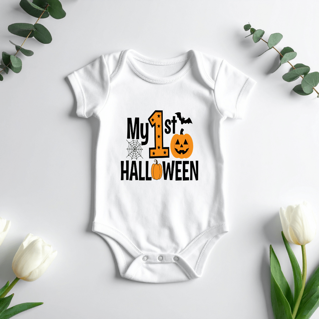 White short sleeve My First Halloween baby onesie hanging on a hanger with pumpkin and bat artwork.
