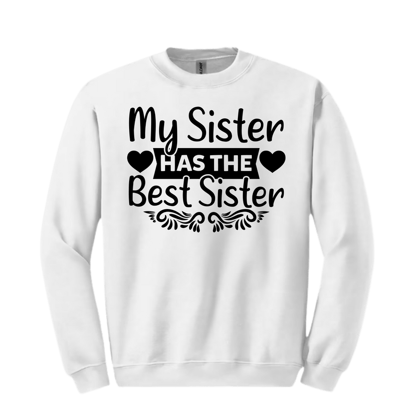 Close-up of black script “HAS THE Best Sister” section with heart cutouts on pink sweatshirt