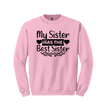 Pink sister sweatshirt flat lay on white background highlighting heart-framed text
