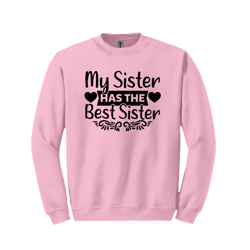 Pink sister sweatshirt flat lay on white background highlighting heart-framed text