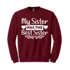 Maroon sweatshirt with white text 'My Sister Has The Best Sister' on a white background