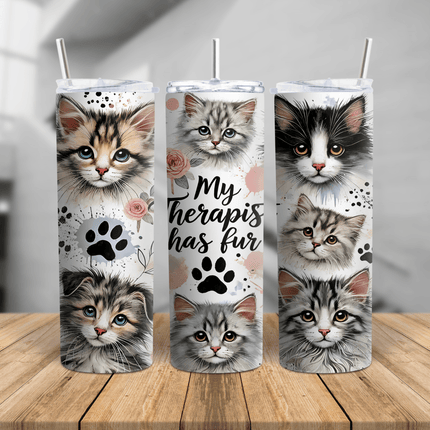 My Therapist Has Fur cat tumbler featuring adorable kitten faces, paw prints, and floral accents on a 20oz or 30oz cup.
