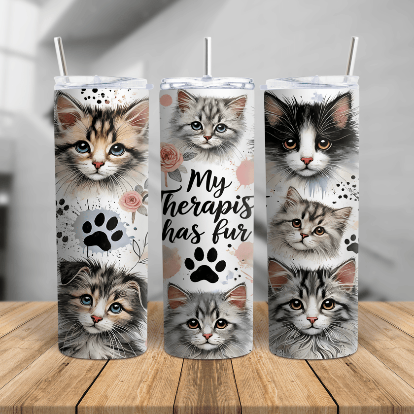 My Therapist Has Fur cat tumbler featuring adorable kitten faces, paw prints, and floral accents on a 20oz or 30oz cup.
