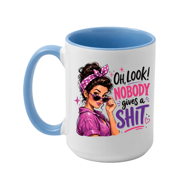 Blue handle coffee mug featuring a bold Nobody Gives a Shit quote with retro illustrated woman and pink purple typography.