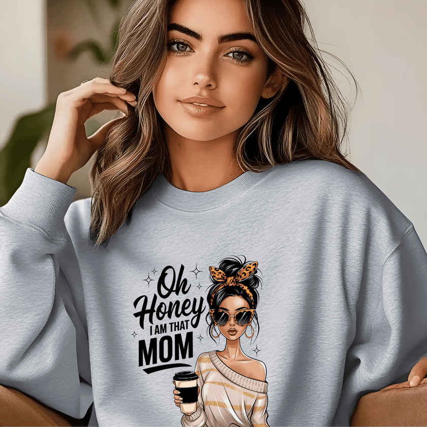 Grey crewneck sweater with bold mom statement graphic in a casual lifestyle setting