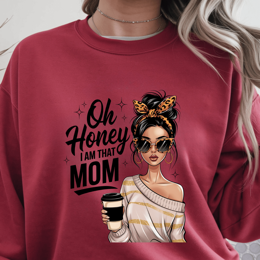 Red crewneck sweater with “Oh Honey I Am That Mom” graphic featuring stylish woman holding coffee