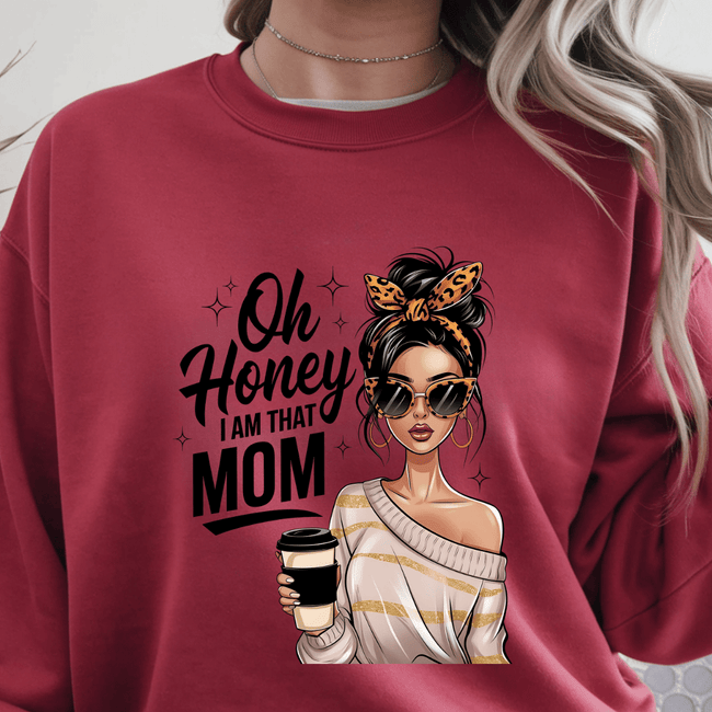 Red crewneck sweater with “Oh Honey I Am That Mom” graphic featuring stylish woman holding coffee