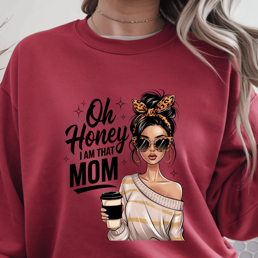 Red crewneck sweater with “Oh Honey I Am That Mom” graphic featuring stylish woman holding coffee