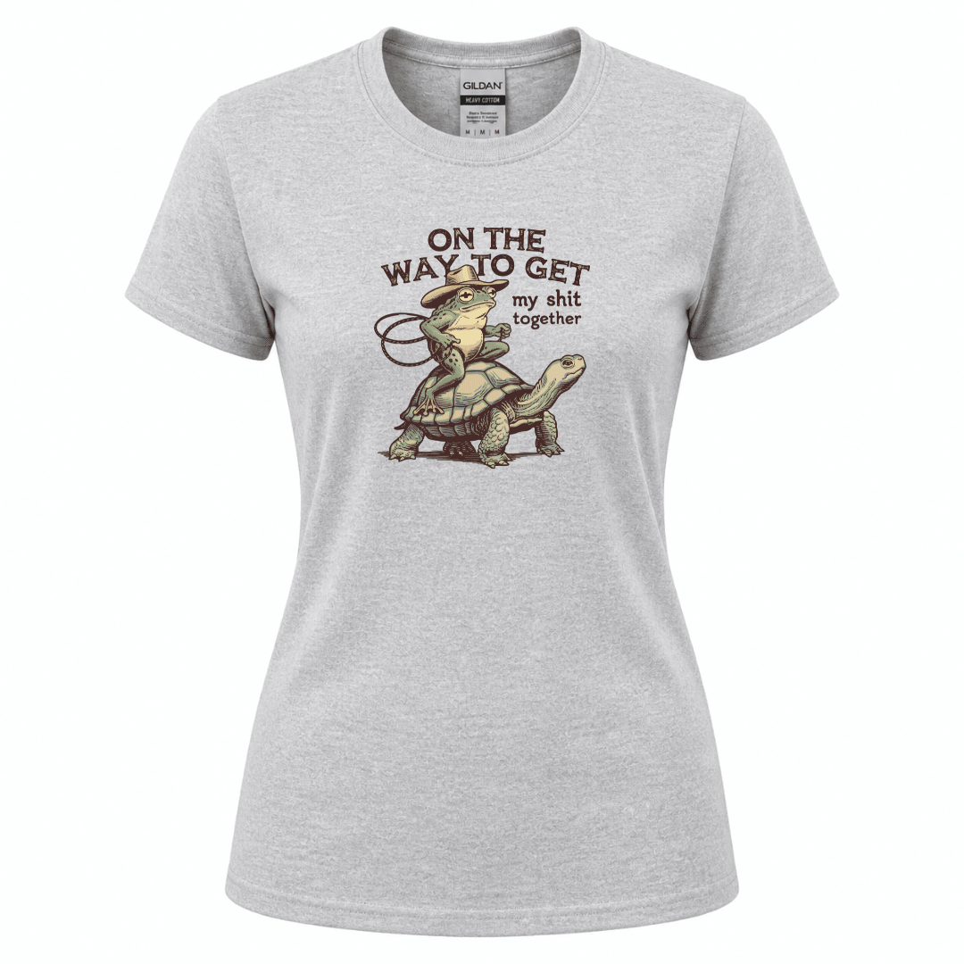 Funny quote apparel featuring cowboy frog illustration riding a turtle slowly