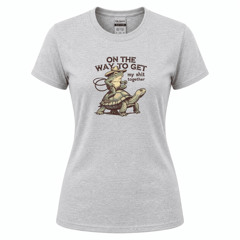 Funny quote apparel featuring cowboy frog illustration riding a turtle slowly