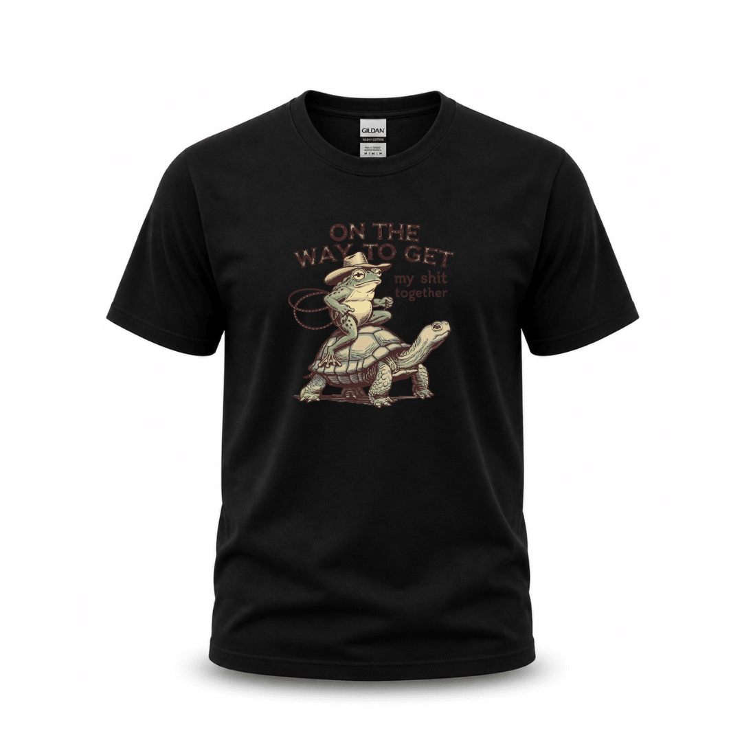 Black graphic T shirt featuring frog riding turtle with funny sarcastic quote design