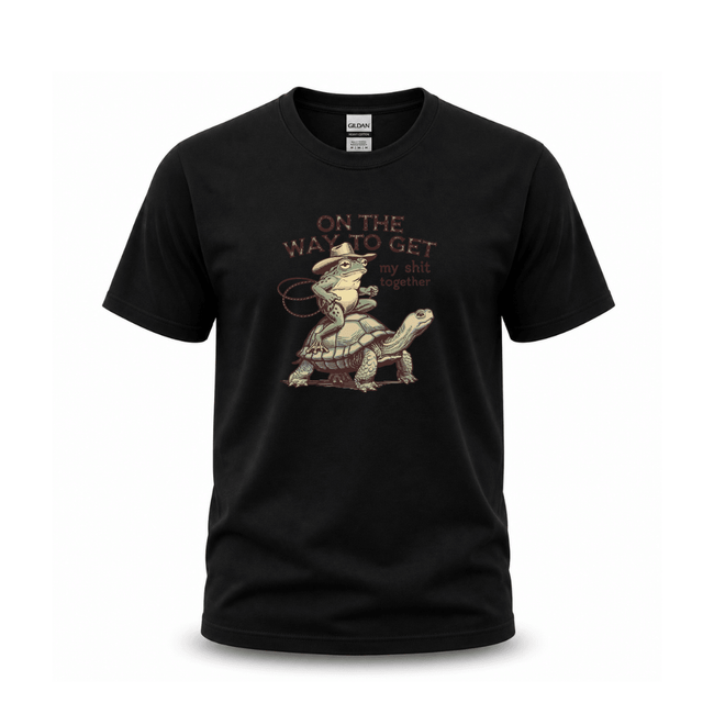 Black graphic T shirt featuring frog riding turtle with funny sarcastic quote design