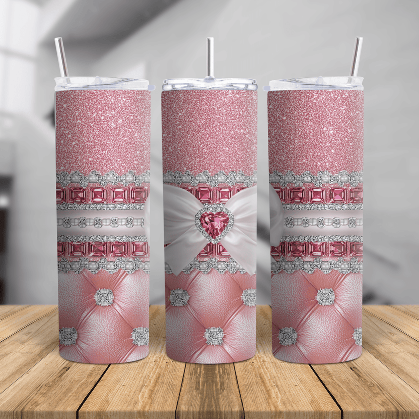 Pink glitter skinny tumbler with white bow, rhinestone heart, pearl accents, and stainless steel design.